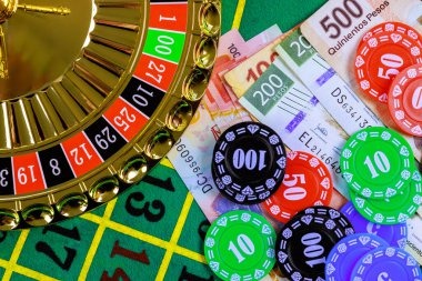 Live blackjack dealer at hausgol studio dealing cards to multiple players